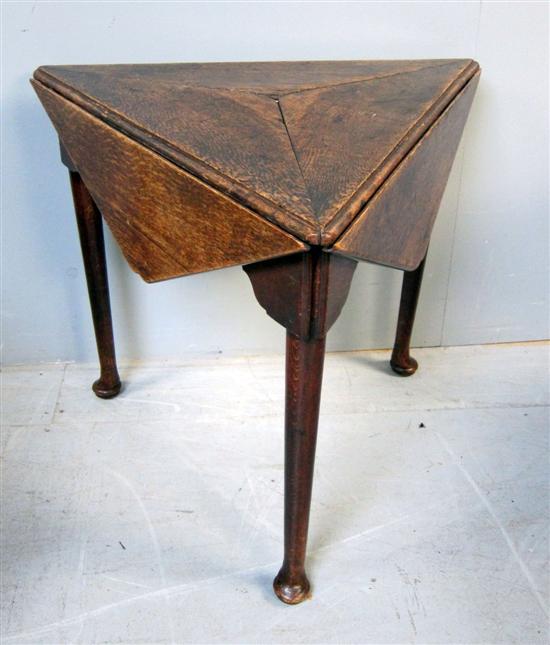 Appraisal: Unusual th century oak revolving triangular table three drop leaves