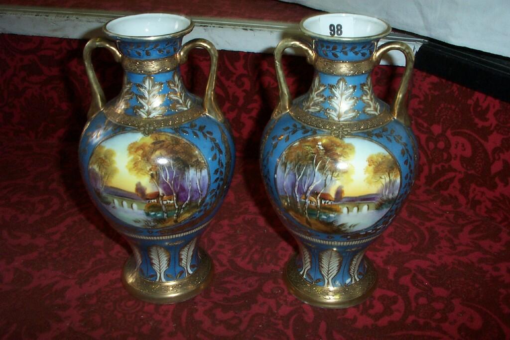 Appraisal: A pair of blue ground Noritake -handled vases with painted