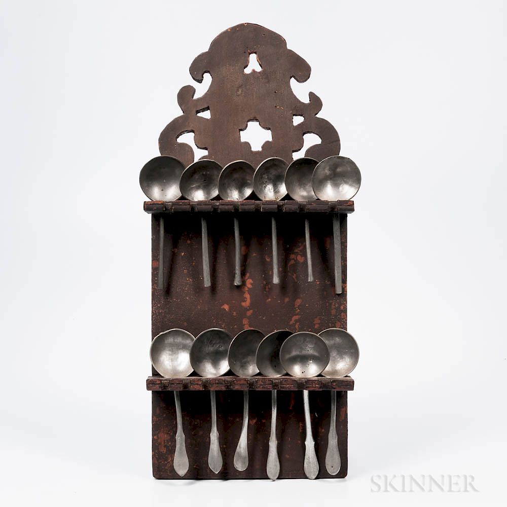 Appraisal: Red Brown-painted Spoon Rack and Twelve Pewter Spoons Red Brown-painted