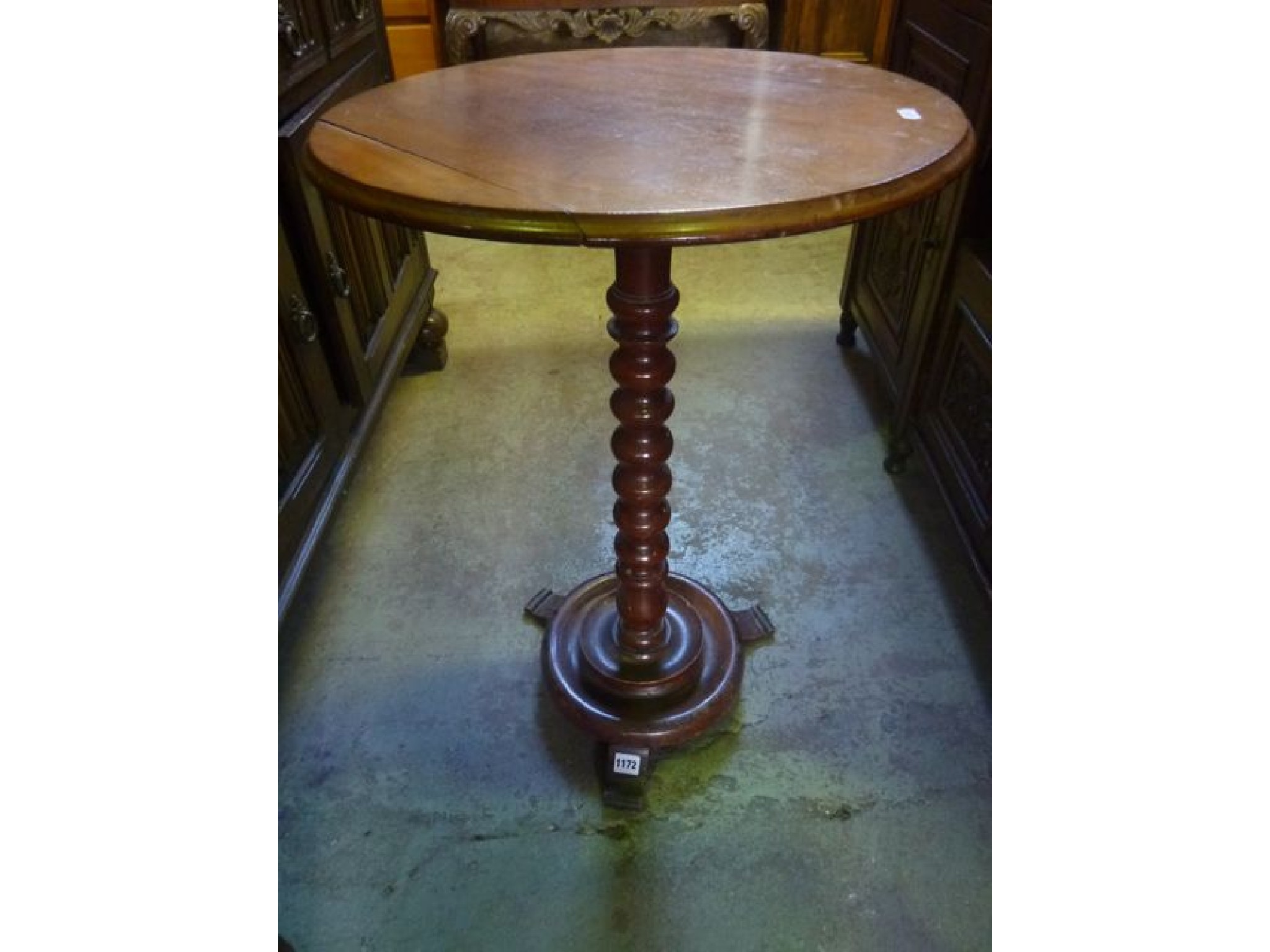 Appraisal: A Victorian mahogany occasional table of circular form raised on