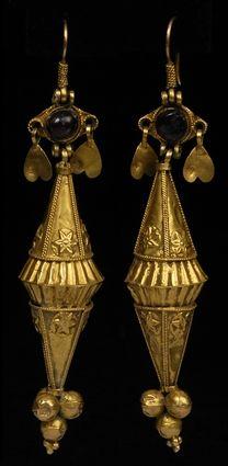 Appraisal: PAIR OF PERSIAN GOLD EARRINGS SET WITH GARNETS in Provenance