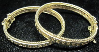 Appraisal: Two karat yellow gold banglesOpen foliate detailing twisted rope accenting