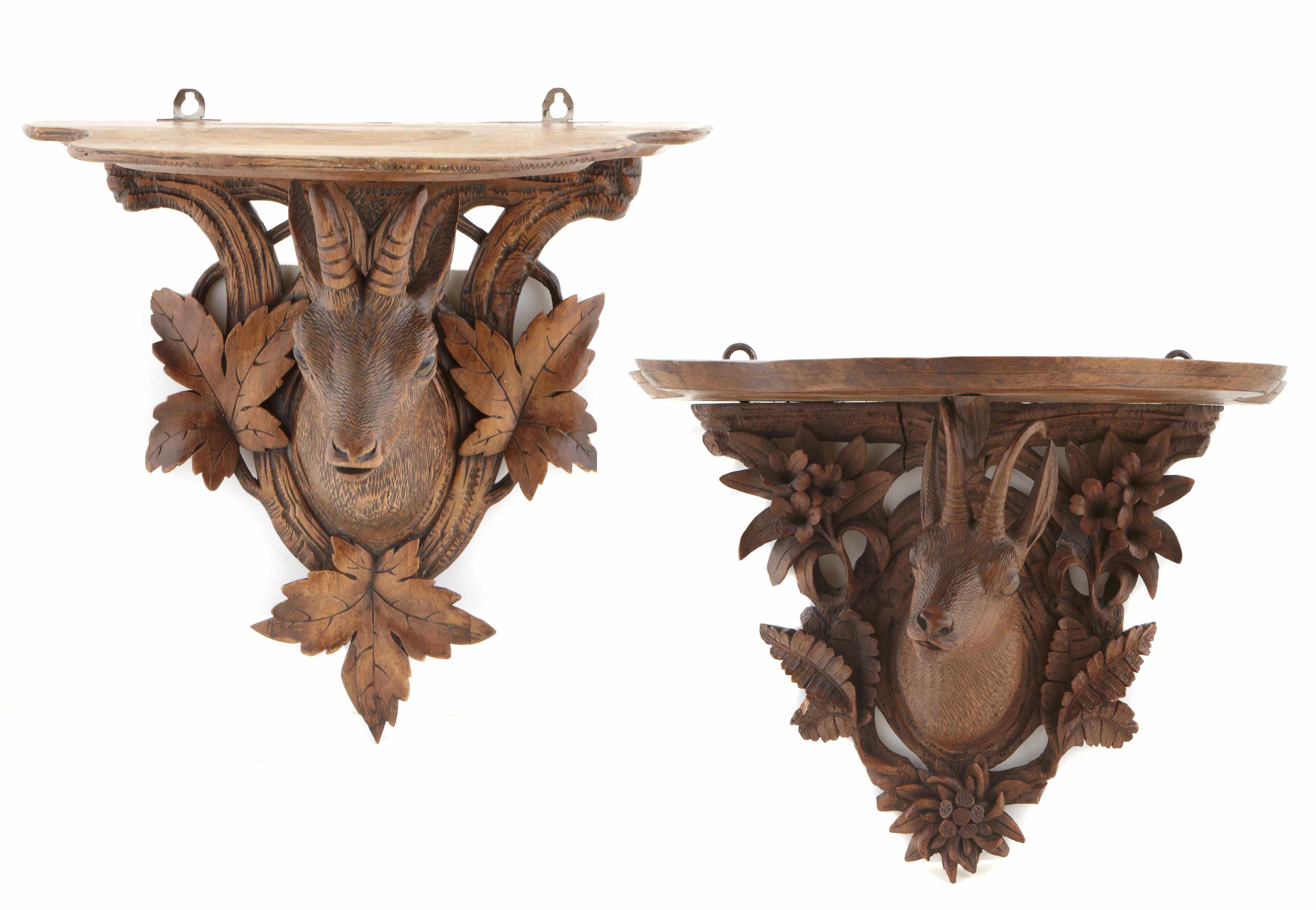 Appraisal: A group of two Black Forest carved lindenwood wall brackets