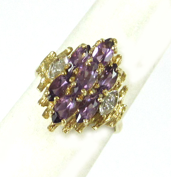 Appraisal: AMETHYST DIAMOND AND FOURTEEN KARAT GOLD RING set with seven