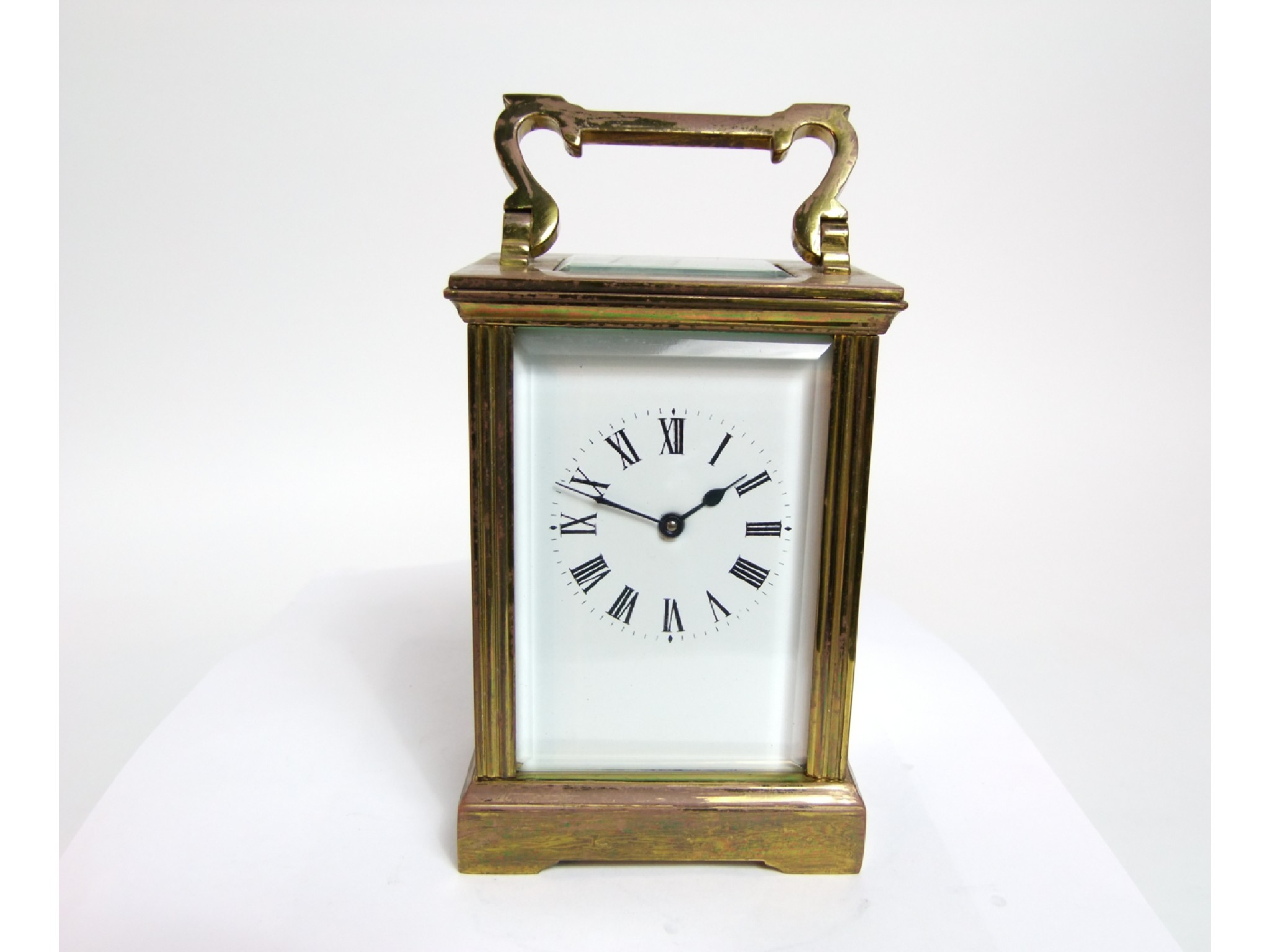 Appraisal: A brass carriage clock with reeded column supports and eight