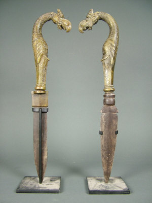 Appraisal: Two South Indian ritual daggers the gilt bronze hilts modelled