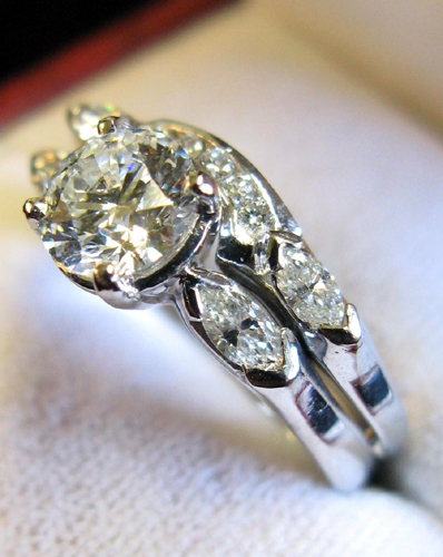 Appraisal: DIAMOND AND PLATINUM WEDDING SET centering a cts round brilliant-cut