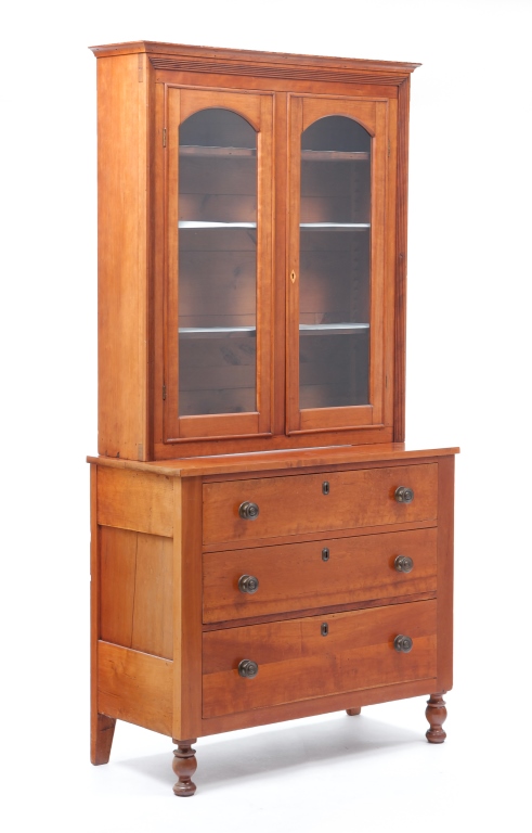 Appraisal: AMERICAN EMPIRE BOOKCASE ON CHEST Second quarter th century cherry