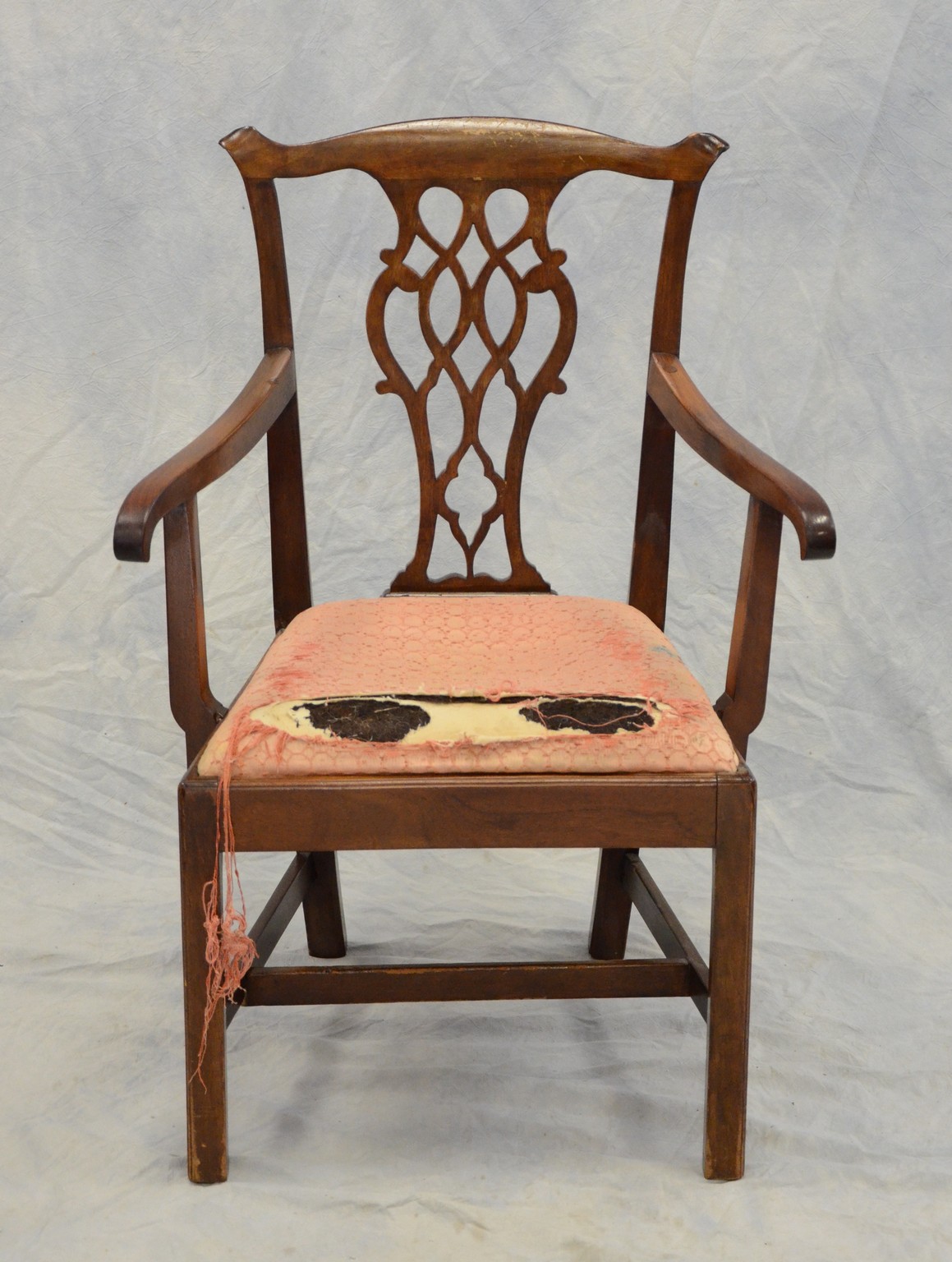 Appraisal: Mahogany Chippendale armchair pierced Gothic splat trapezoidal slip seat plain