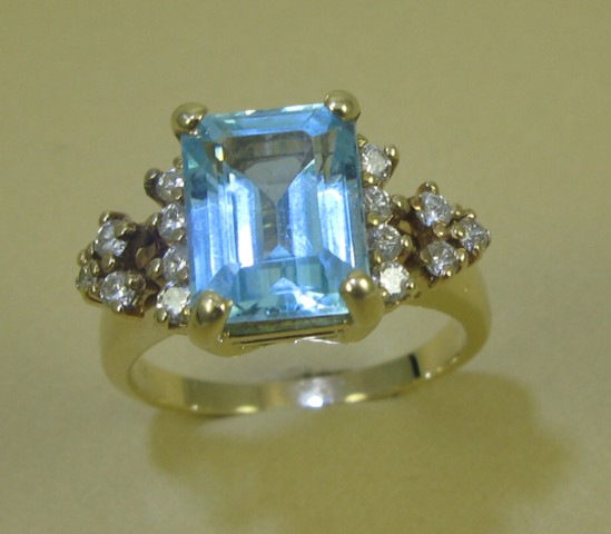 Appraisal: BLUE TOPAZ DIAMOND AND FOURTEEN KARAT GOLD RING centering an