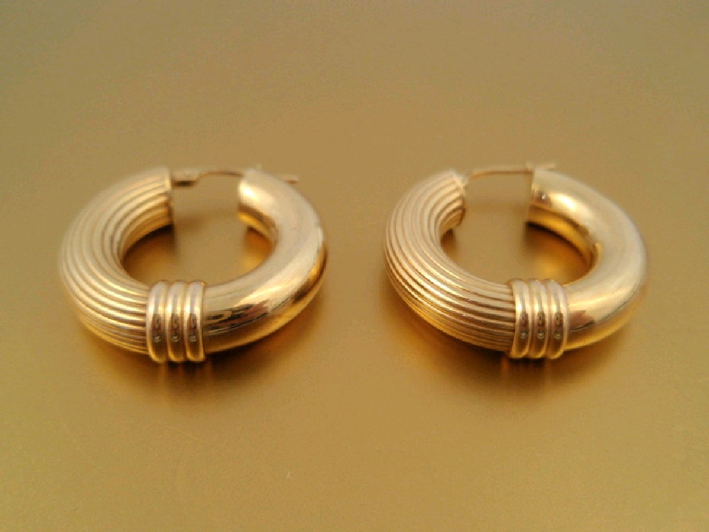 Appraisal: A pair of hollow hoop earrings stamped for ct g