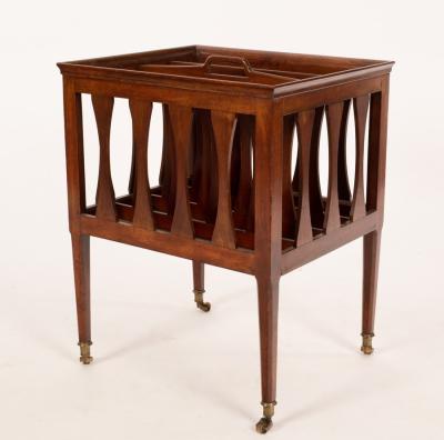 Appraisal: An Arts Crafts period mahogany Canterbury with incorporated handle on