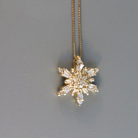 Appraisal: Diamond Starburst Pendant round baguette diamonds totaling over carat in