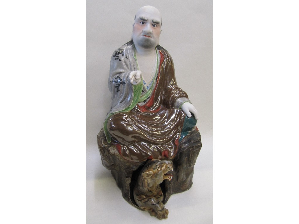 Appraisal: Japanese figure of a robed gentleman seated on a rock