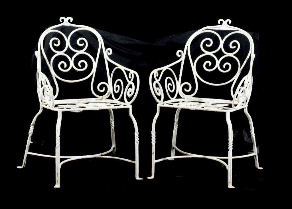 Appraisal: A PAIR OF WROUGHT IRON GARDEN CHAIRS of round section