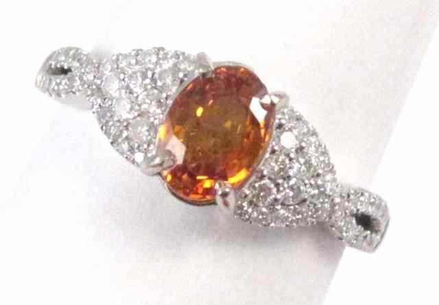 Appraisal: ORANGE SAPPHIRE AND DIAMOND RING k white gold with pave'