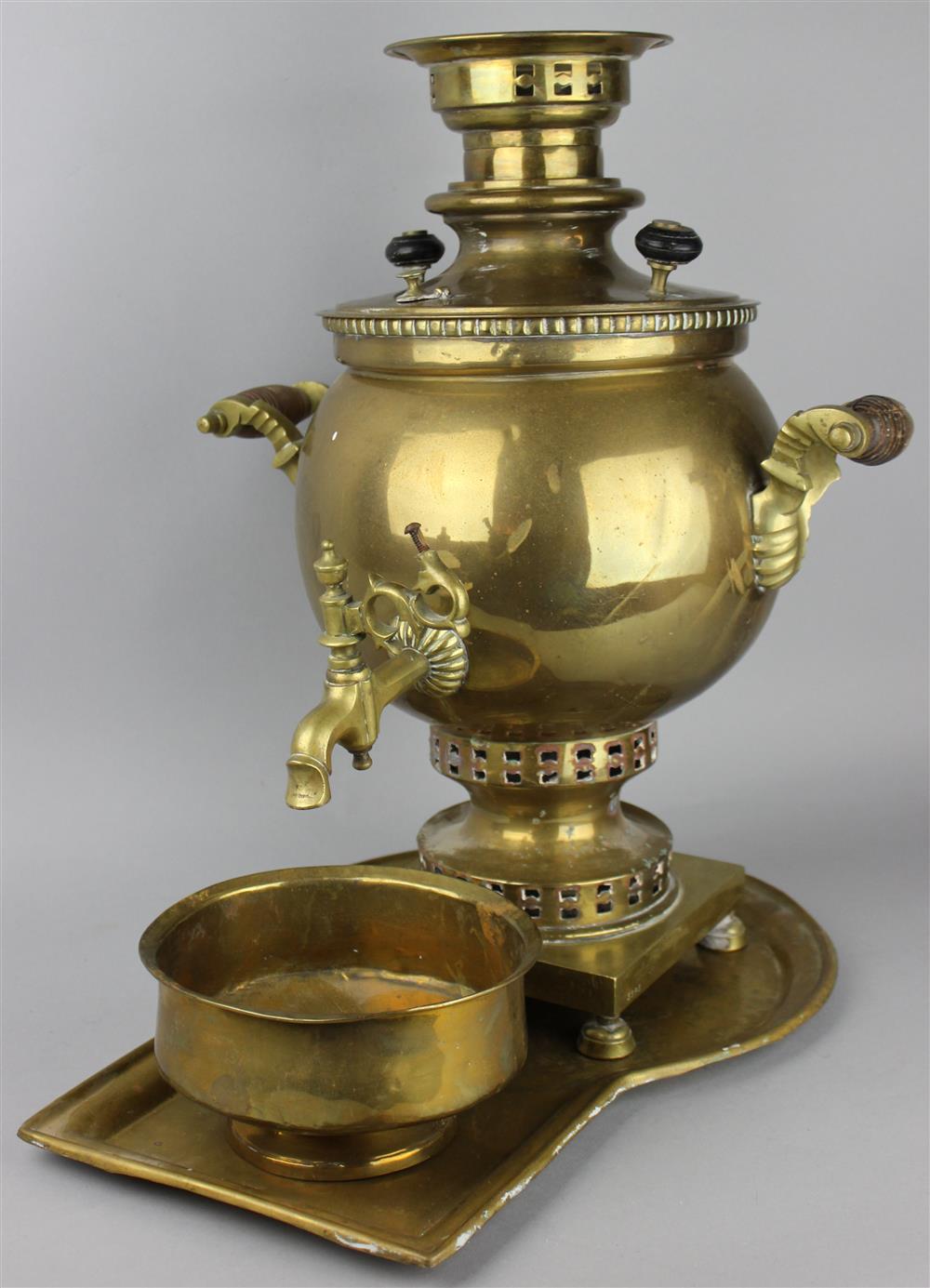 Appraisal: RUSSIAN BRASS SAMOVAR AND UNDERTRAY the samovar with curved handles