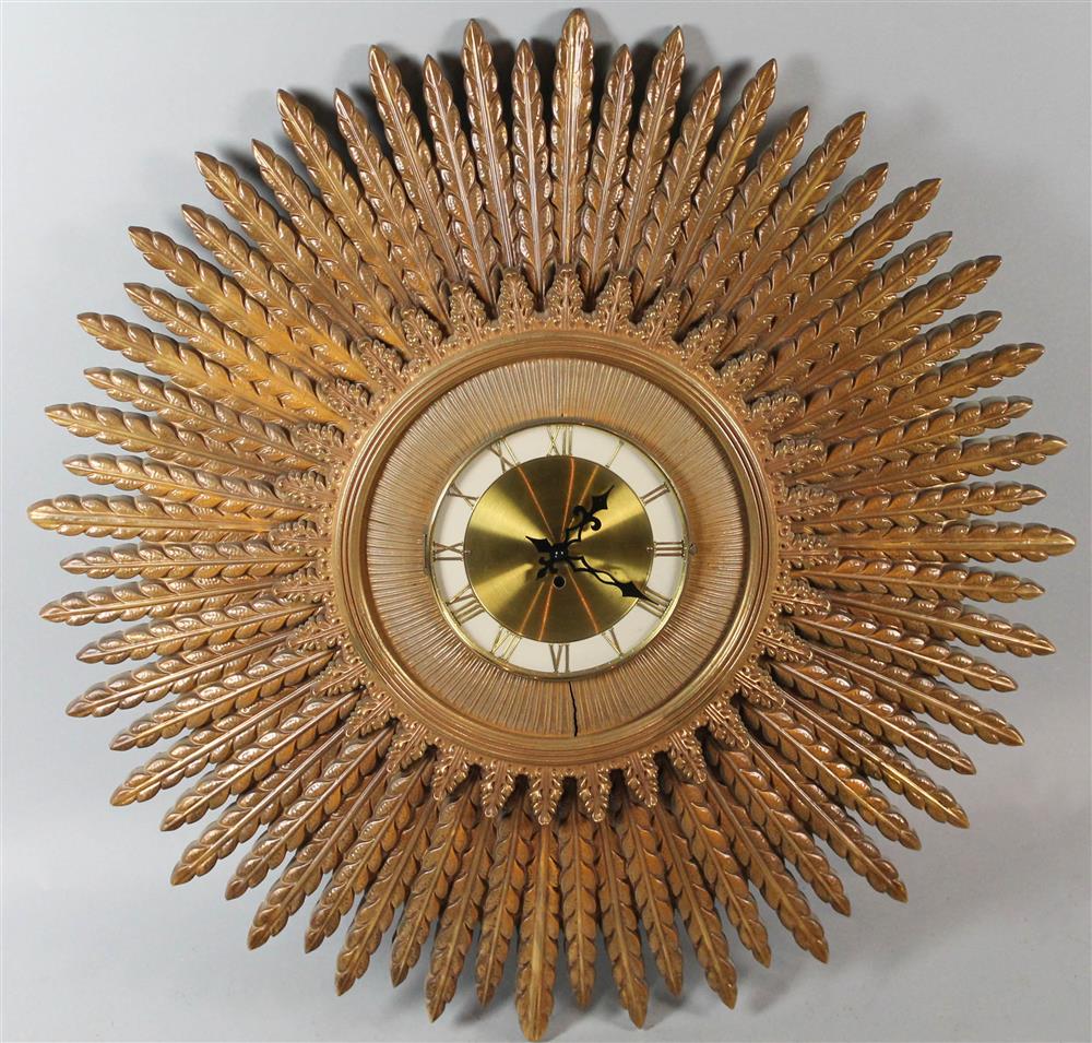 Appraisal: SUNBURST WALL CLOCK WITH ROMAN NUMERALS convex face with glass