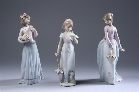 Appraisal: THREE LLADRO PORCELAIN FIGURES Basket of Love Summer Stroll Innocence