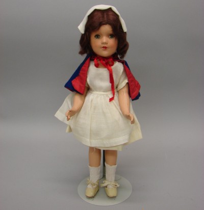 Appraisal: Unmarked R B type composition nurse doll Blue tin sleep