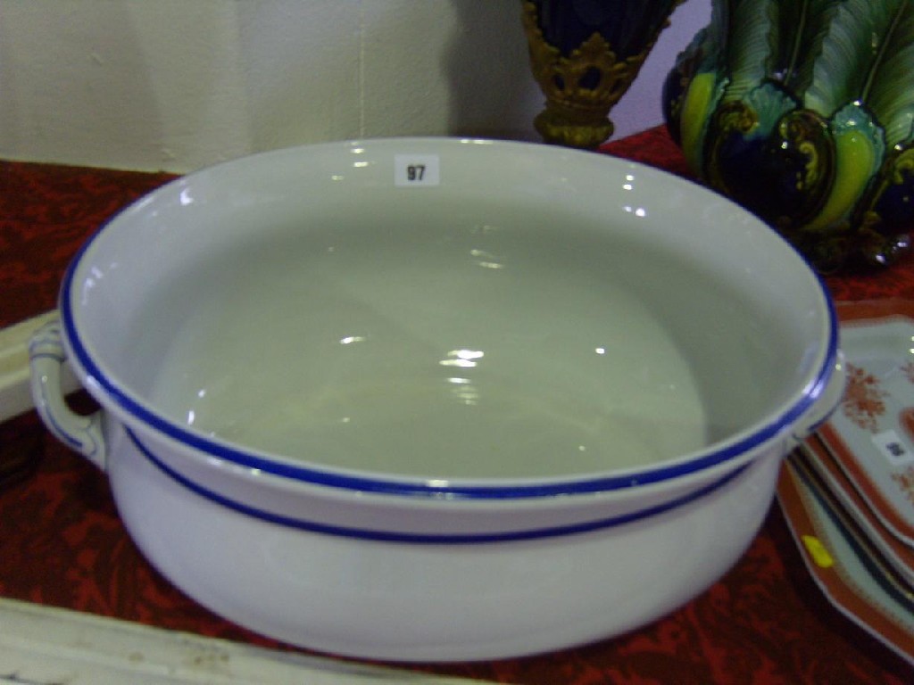 Appraisal: A th century -handled footbath of oval form with blue