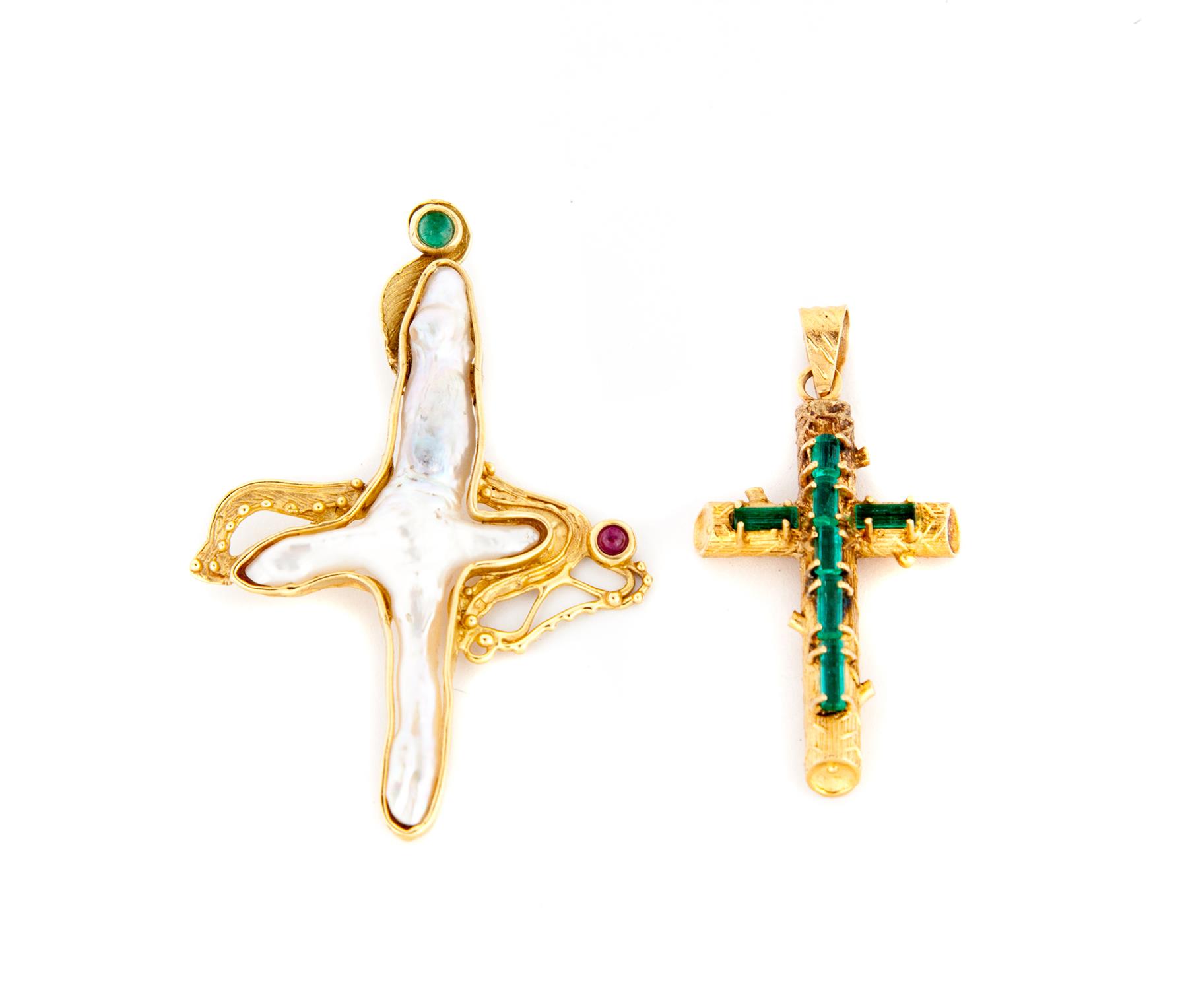 Appraisal: TWO CROSS PENDANTS American st century KYG cross formed to