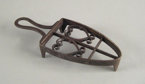 Appraisal: Wrought iron trivet ca with heart motif the sides with