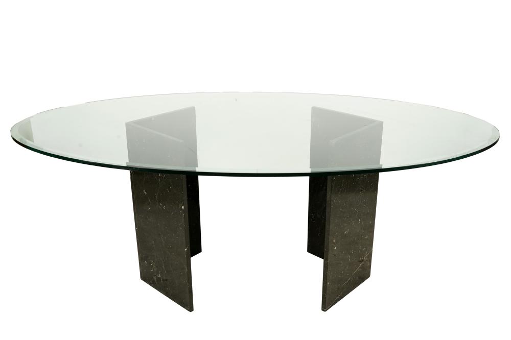 Appraisal: MODERNIST DINING TABLEthe oval-shaped top with beveled edge resting on