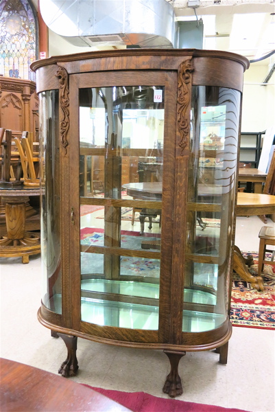 Appraisal: LATE VICTORIAN OAK AND CURVED GLASS CHINA DISPLAY CABINET American