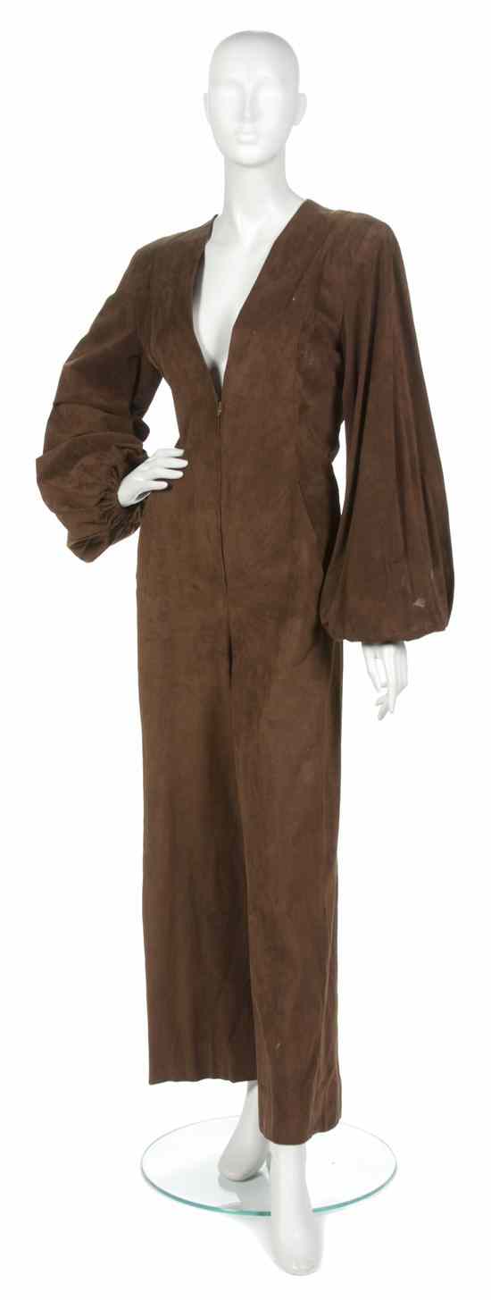 Appraisal: A Pauline Trigere Brown Suede Jumpsuit with plunging 'V' neckline