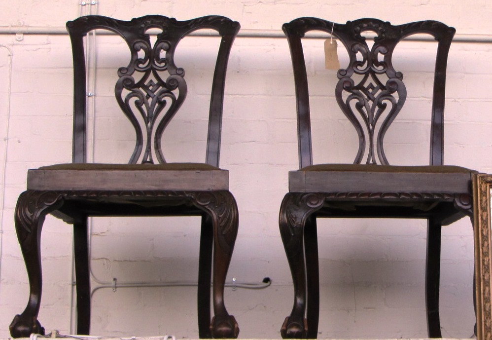 Appraisal: A pair of Chippendale style mahogany dining chairs on claw