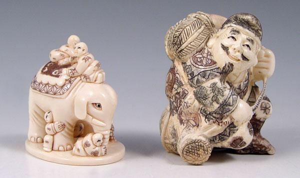 Appraisal: CARVED IVORY NETSUKE Carved elephant with children figures Signed in