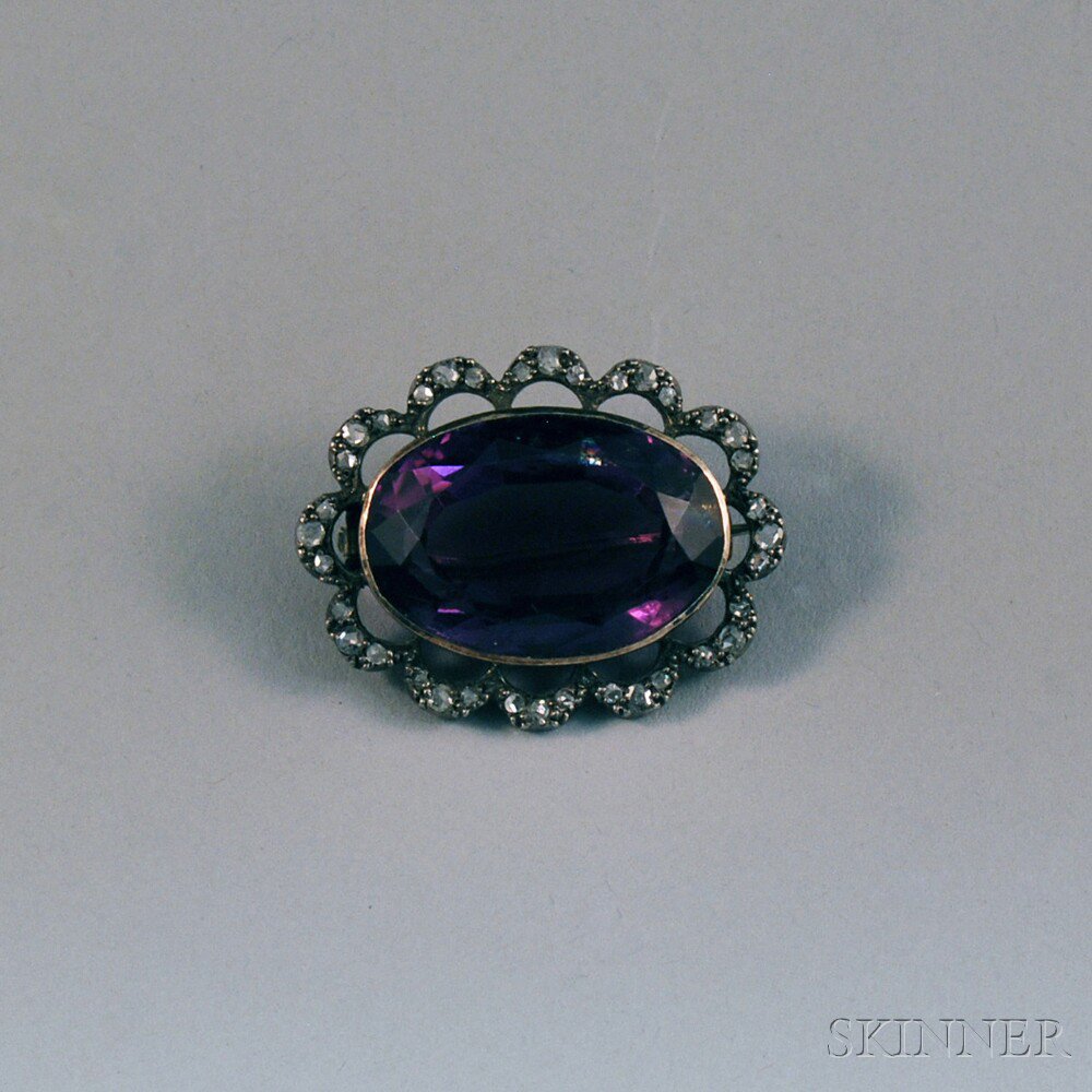 Appraisal: Low-karat Gold Amethyst and Diamond Brooch centering an oval-cut amethyst