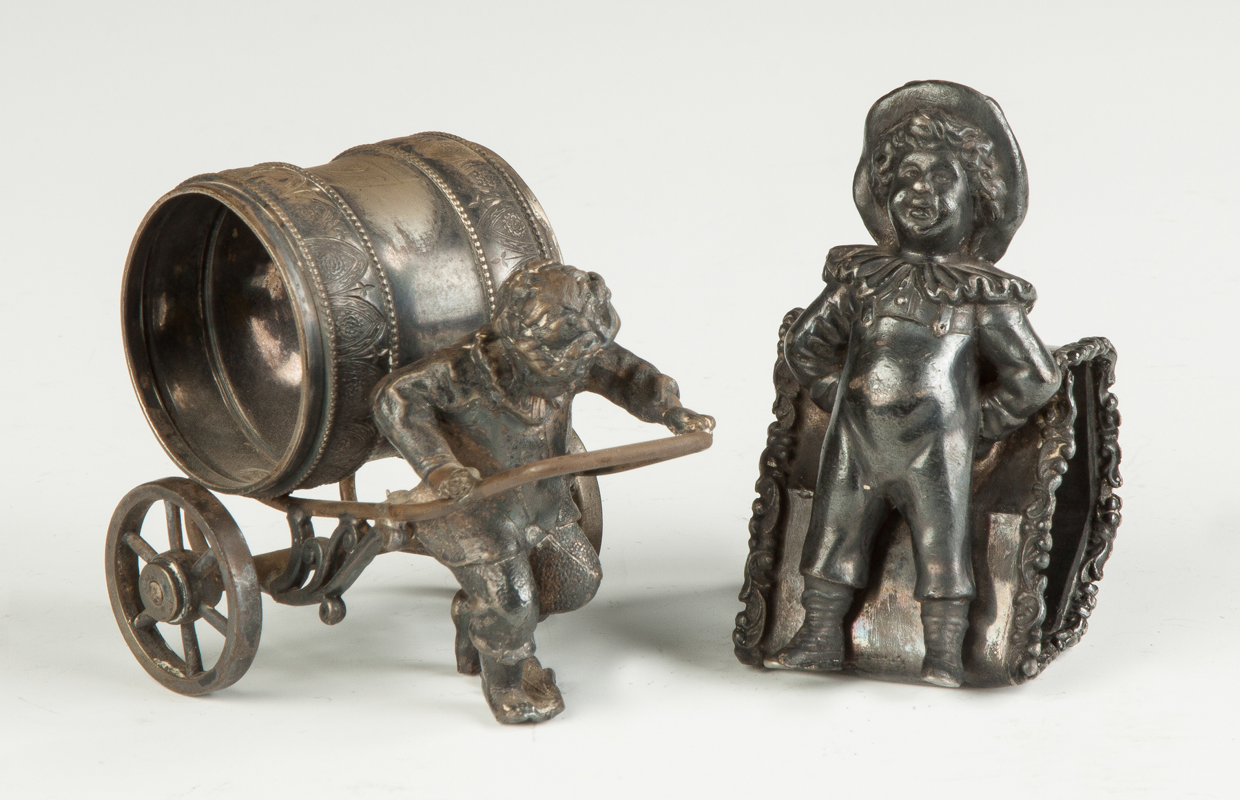 Appraisal: Victorian Silverplate Napkin Rings th cent Boy pulling cart is