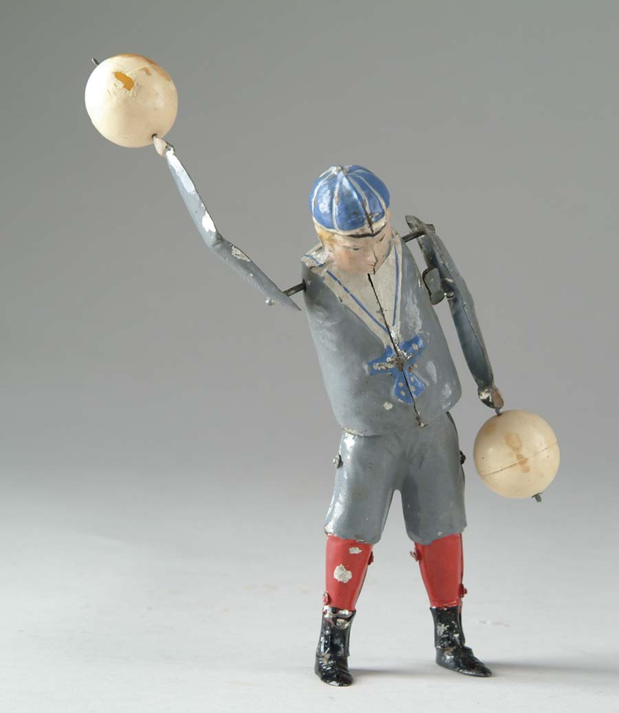 Appraisal: EARLY TIN JUGGLER Hand-painted all tin figure with lead feet