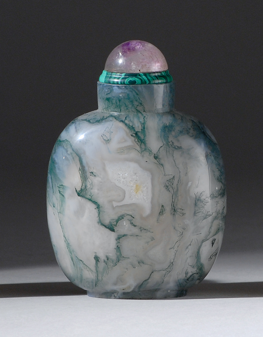 Appraisal: GREEN AND WHITE FLOATER AGATE SNUFF BOTTLE Mid- th CenturyIn