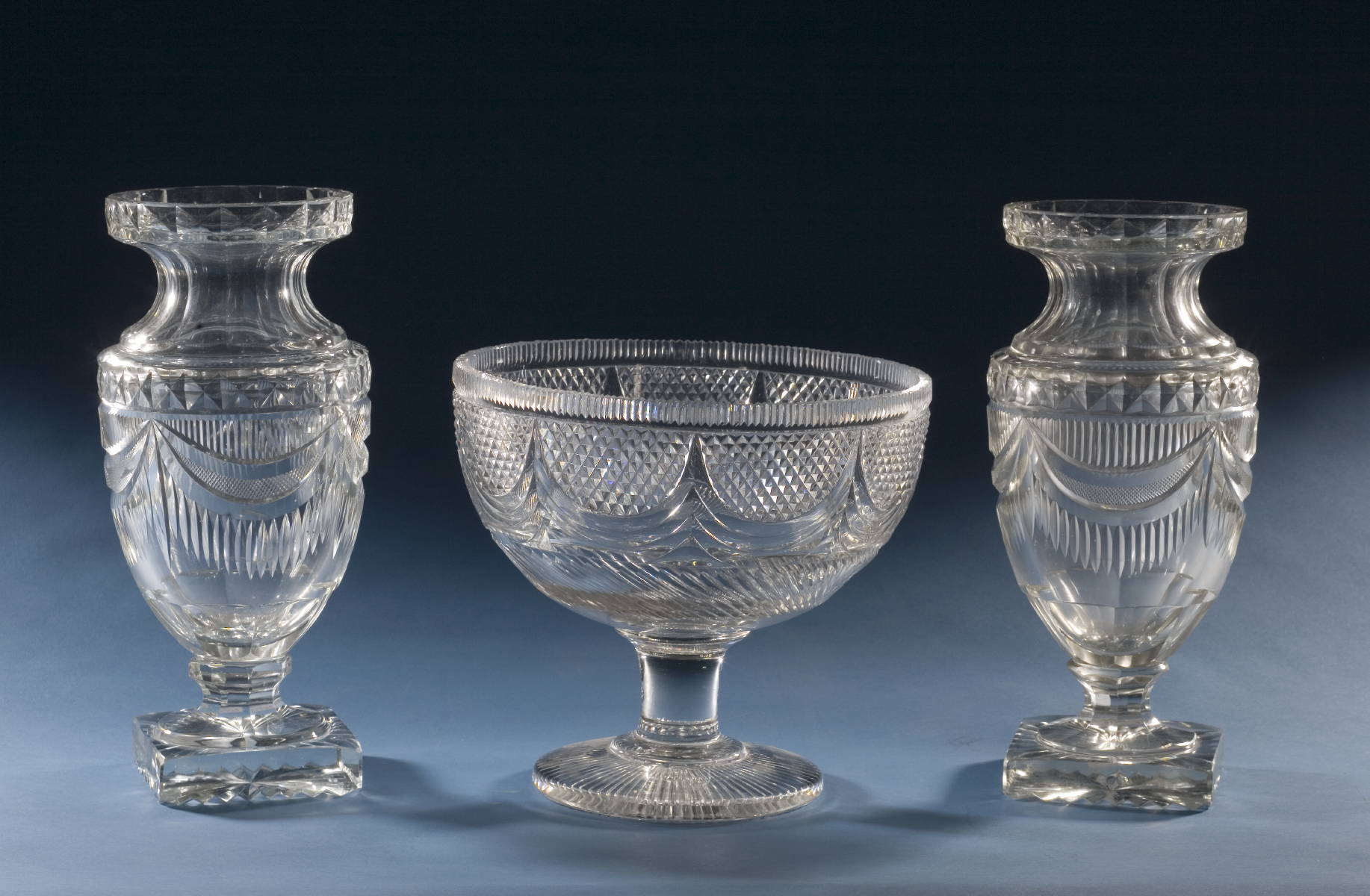 Appraisal: PAIR OF ANGLO-IRISH CUT GLASS VASES AND A COMPANION FOOTED