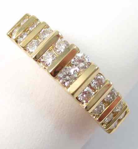 Appraisal: DIAMOND AND FOURTEEN KARAT GOLD RING set with round-cut diamonds