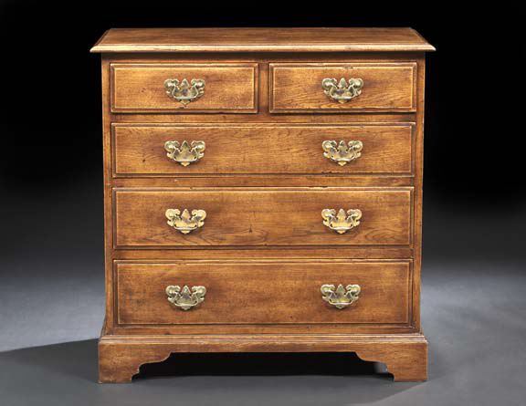 Appraisal: Pair of George III-Style Oak Five-Drawer Chests the overhanging molded