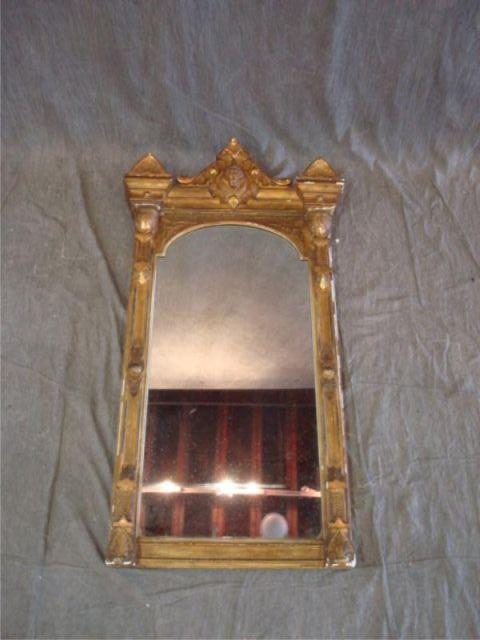 Appraisal: Victorian giltwood mirror with heads From a NYC estate Dimensions