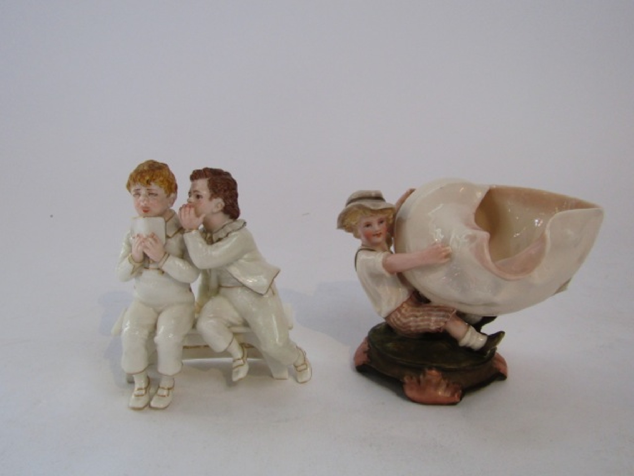 Appraisal: An unusual James Hadley Royal Worcester figure group of two