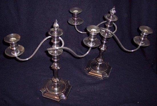 Appraisal: A pair of two-branch three-light candelabra cm high including flame