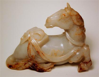 Appraisal: Chinese mottled brown and celadon jade horseRecumbent beast surmounted by