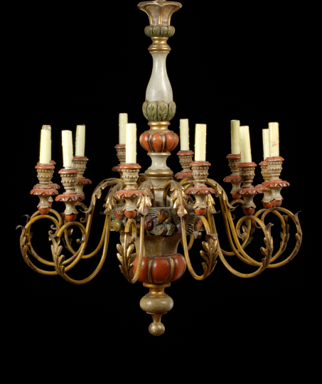 Appraisal: Patinated and Polychromed Carved Wood and Brass Twelve-Light Chandelier the