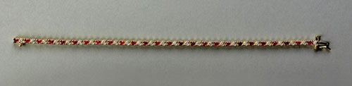 Appraisal: K yellow gold tennis bracelet with diamonds and rubies approx