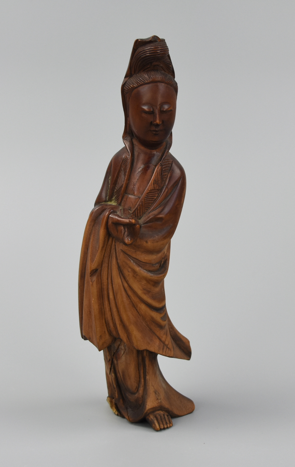 Appraisal: CHINESE CARVED HUANGYANG WOOD GUANYIN FIGURE A wood carved standing