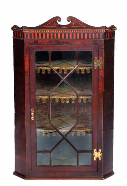 Appraisal: A LATE GEORGIAN MAHOGANY HANGING CORNER CABINET the chequer inlaid