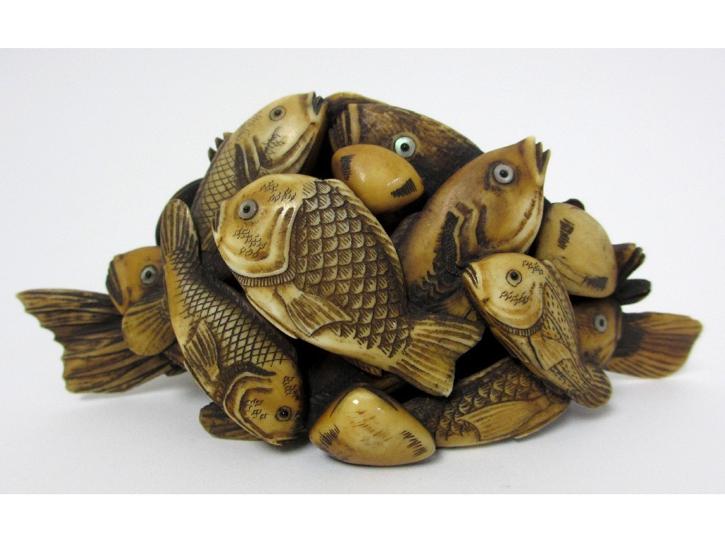 Appraisal: A Japanese carved ivory model of numerous fish and scallops