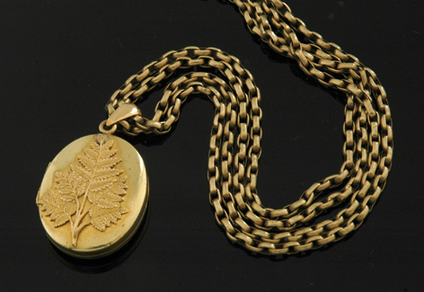 Appraisal: CONTINENTAL SILVER GILT HINGED LOCKET AND MUFF CHAIN