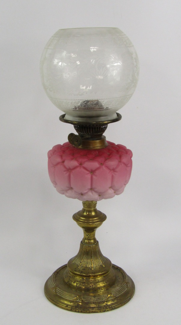 Appraisal: A Duplex brass oil lamp with a pink opaline glass